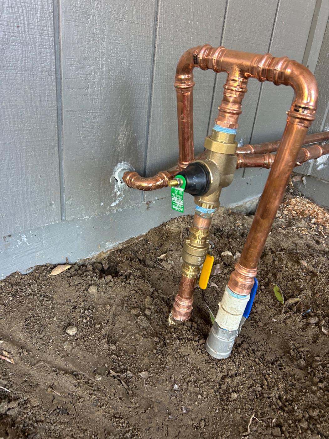 New pressure reducing valve and copper piping at a San Jose home water main